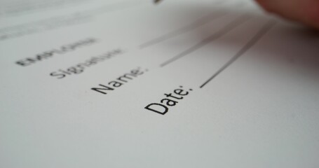 A man puts his signature on behalf of a company representative, close-up of his signature, an...