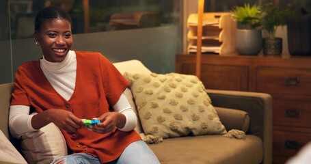 Woman, psychology and fidget in office for therapy, social development and healing at night. Happy client, consultation and support in late session for mental health, ADHD and toy for anxiety relief