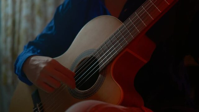 teenager playing classical guitar, fashionable instrument. hobby and professional music training. fretboard.music training, professional guitar music cinematic
