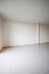 White room for the background. empty room interior, white mortar wall and clean tile floor in a new house