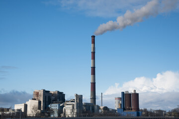 Fototapeta premium A coal-fired power plant emits greenhouse gases into the atmosphere. 