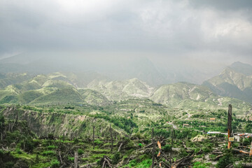 Lush Green Landscape of Mount Merapi One Year After 2010 Eruption With Dramatic Clouds