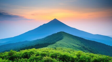 Fototapeta premium Mountain peak nature idea. Majestic mountain peak against a vibrant sunset sky with lush green hills.