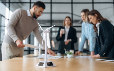 Power management in wind turbine company. Business people are working in the office