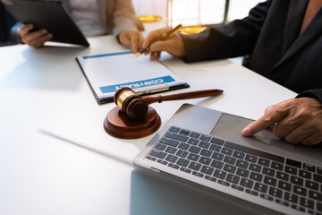 Business people and lawyers discussing contract papers sitting in the table at office in the morning. concepts of law, advice, legal services..