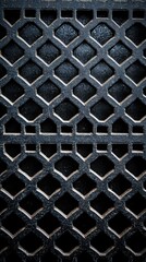 Intricate Black Metal Grate with Diamond Patterns and Texture