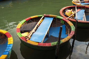 Obraz premium Round basket boats, woven from bamboo, are used to transport tourists in Cam Thanh nipa palm forest, Hoi An, Vietnam 