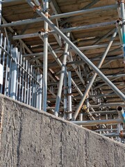 Large Industrial Building Covered and Surrounded with Scaffolding