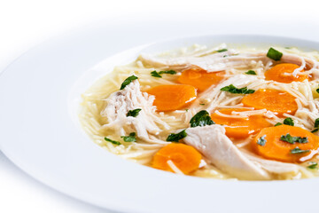 Homemade chicken soup with carrot isolated on white background. Close up