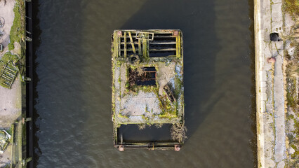Aerial view of derelict wooden jetty 