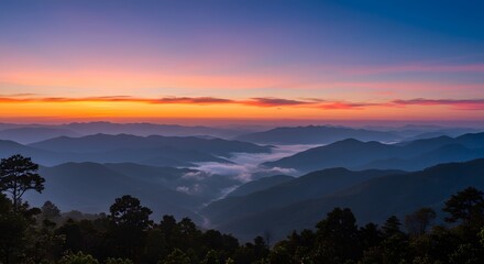 Obraz premium Majestic Sunrise Mountain Landscape with Foggy Valley