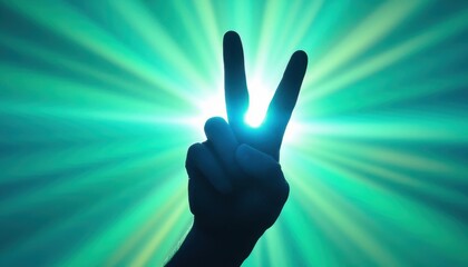 Silhouette hand peace sign against radiant green and blue light burst