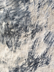 Close up of heavily weather concrete wall with cracks and moss corrosion Grungy Masionary Background