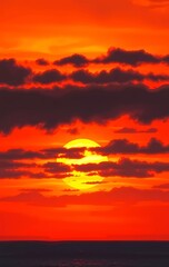 Naklejka premium Red dramatic sunset sky over the horizon water