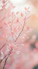 Fototapeta premium Delicate Pink Leaves on Branches Against a Soft Blurred Background
