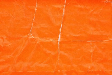 Old orange wallpapers glued to the wall, folds and scratches, White paper texture with folds and wrinkles, abstract vintage background