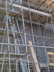 Large Industrial Building Covered and Surrounded with Scaffolding