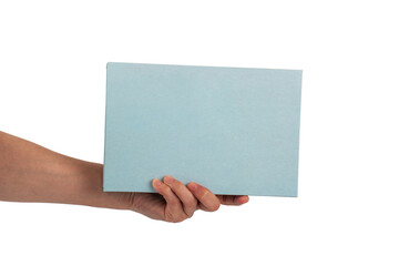 Obraz premium Blank blue book cover in hand on transparent background.