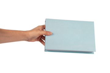 Blank blue book cover in hand on transparent background.