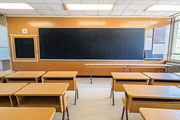 Retro classroom setting with blackboard and desks