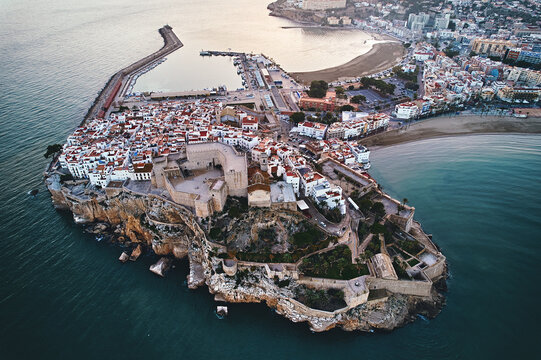 Breathtaking aerial view of Peníscola, historic coastal town in Spain at sunset - Powered by Adobe