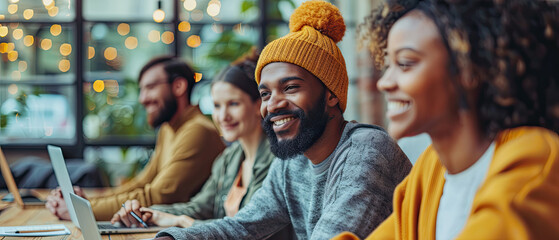 Obraz premium Group of young adults collaborating in a stylish workspace during a creative brainstorming session in the evening