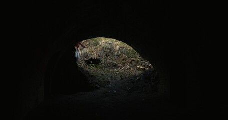 Three friends run into the basement of a destroyed building. The view from the inside