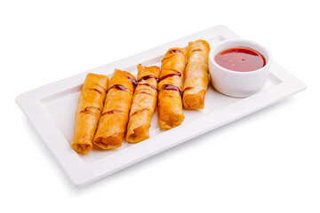 Delightful crispy spring rolls served with sweet and tangy dipping sauce on a white platter