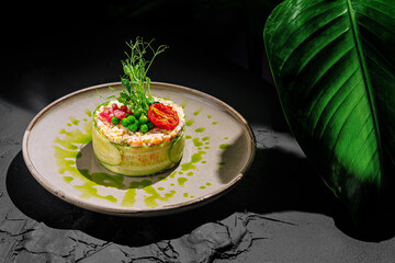 Delicate culinary creation with vibrant greens and fresh ingredients served elegantly on a textured plate