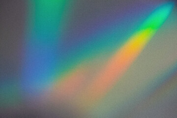 Blurred rainbow light refraction texture overlay effect for photo and mockups.