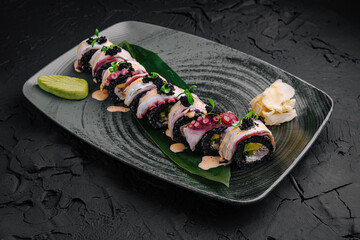 Delicious sushi rolls with fresh ingredients served on a stylish plate