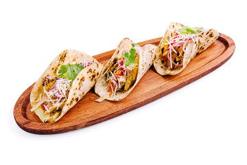Delicious tacos served on a wooden platter garnished with fresh ingredients and flavors