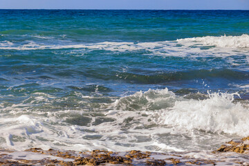 rocky coastline with crashing waves on the island of Cyprus near the city of Paphos in Greece in November