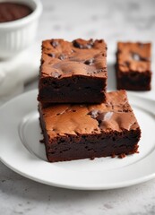 Soft, fluffy, and airy texture of classic soft brownie on a white porcelain plate, soft, porcelain, ethereal texture