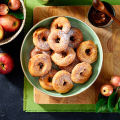 Apple rings fried in batter. Apple donuts - autumn dessert. top view