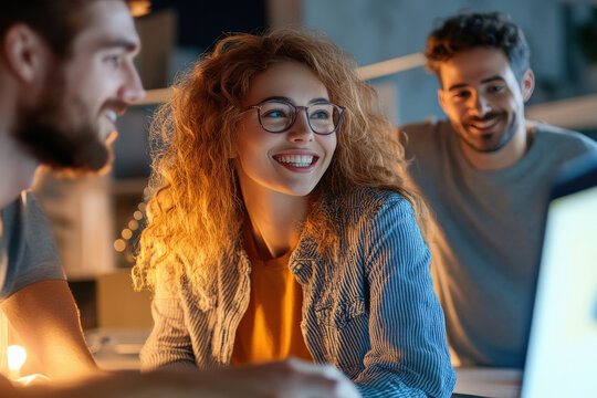 vibrant digital ads and designs projected around a team of creatives brainstorming in a modern office