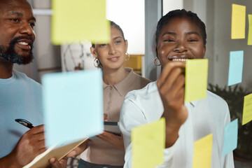 Office, teamwork and business people with sticky note for brainstorming, planning session and...