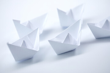 paper boats on the white background, business concept