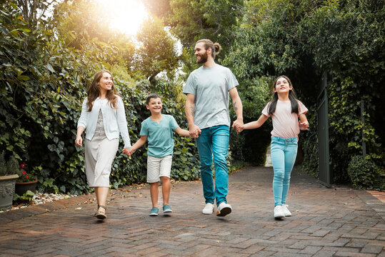 Parents, holding hands or happy kids walking in park or neighborhood for bonding, adventure and weekend fun. Family, outdoor and mom with boy, girl or father with safety, siblings and smile in garden