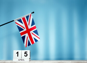 Fototapeta premium April Calendar With British Flag With Number 15. Calendar cubes with numbers. Space copy.