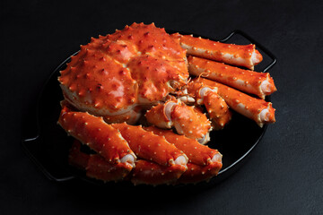 Giant Kamchatka King Crab on a Table. Protein-Rich Healthy Food Concept. Selective Focus, Dark Background. Handmade Photo, Not AI