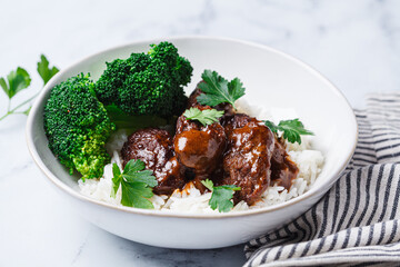 Beef meatballs with rice and broccoli. Scandinavian cuisine.