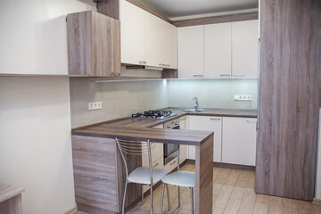 Modern kitchen design featuring sleek surfaces and minimalist furnishings