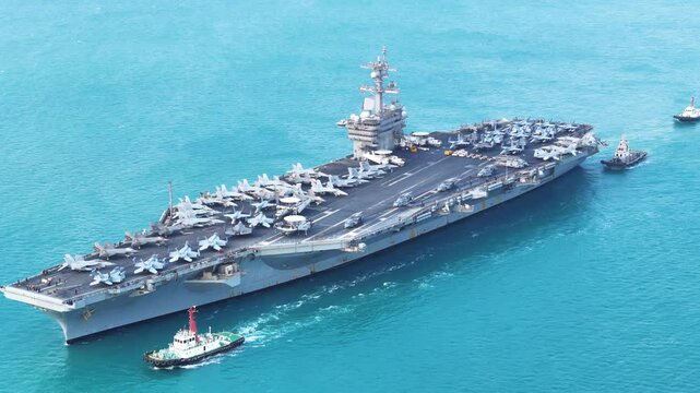 Nuclear war ship, Navy ship, Military navy. nuclear carrier running in the ocean. Military navy ship carrier full loading fighter jet aircraft for prepare troops
