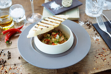 Shrimp pil-pil. King prawns, garlic, chilli and baguette. Delicious Spanish traditional food closeup served for lunch in modern gourmet cuisine restaurant