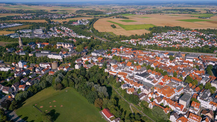 Aerial around the city Friedberg in Hesse in Germany on a sunny day in summer.