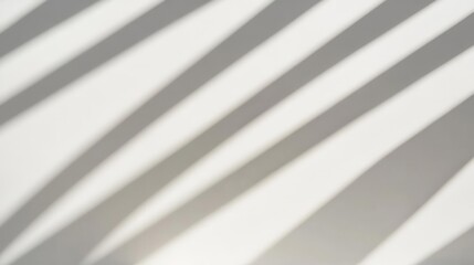 Obraz premium A minimalist black-and-white composition of geometric shadows cast across a smooth white wall creates a modern abstract art vibe.