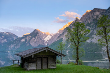 Wooden house on mountain lake Koenigssee Berchtesgaden National Park Bavaria Germany