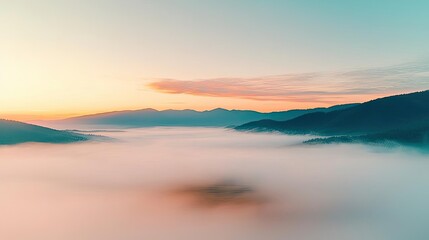 Fototapeta premium Misty mountain nature idea. Breathtaking sunrise over misty mountains, showcasing nature's serene beauty and tranquility.