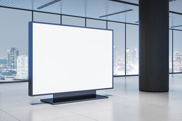 Fototapeta premium Blank digital display in modern office building with city view in background. 3D Rendering